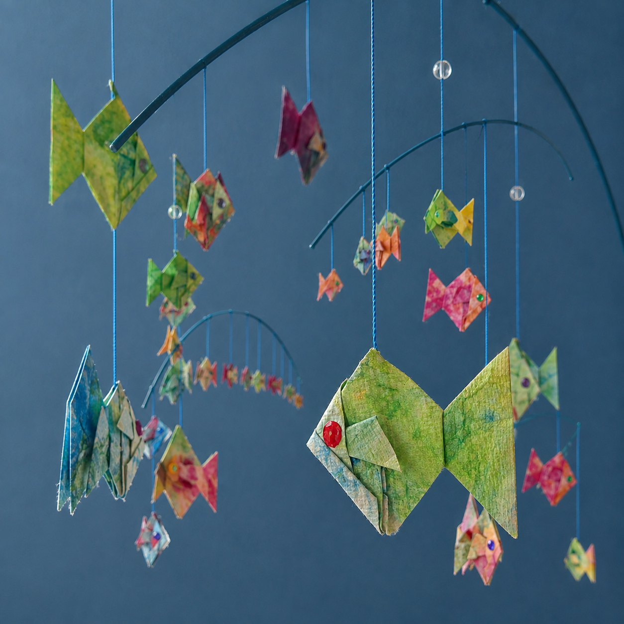 multi hued suspended fish mobile set for children and toddlers