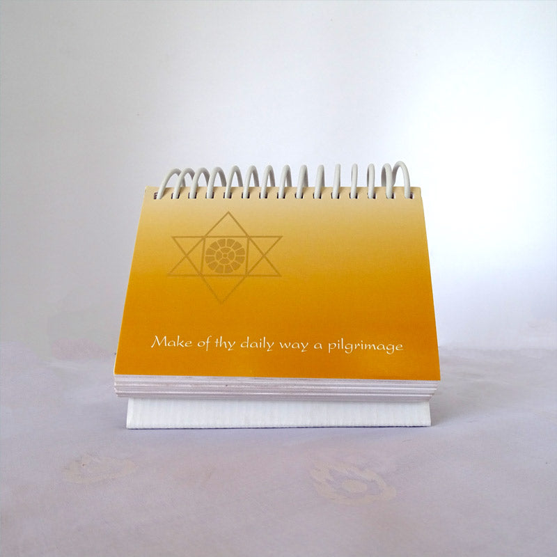 A daily quotation desktop calendar... Its cover is designed with hues of golden yellow and imprinted with NavaVihan's logo in gold.